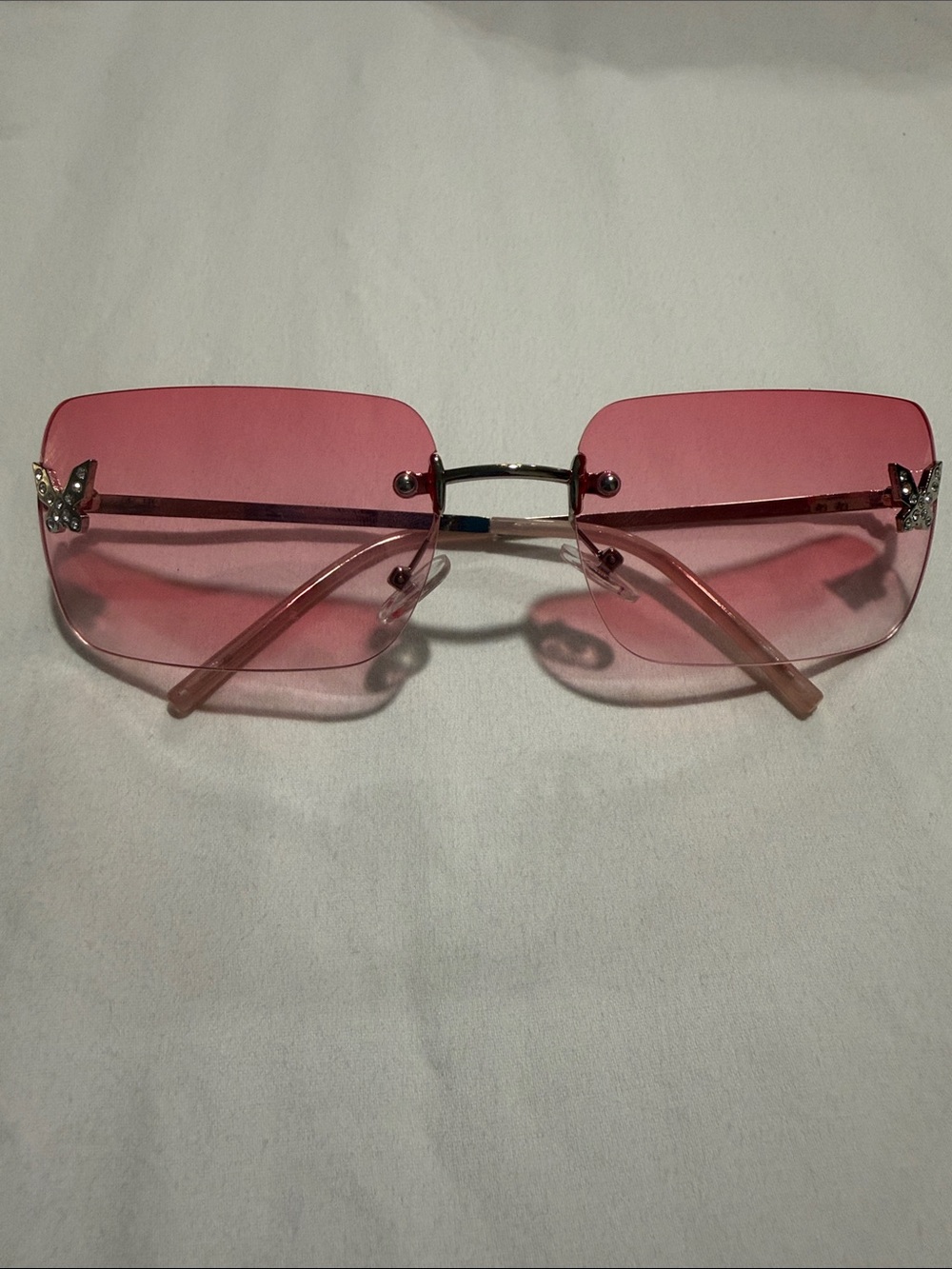 Rimless Pink Butterfly Accent Sunglasses - Women's Accessories